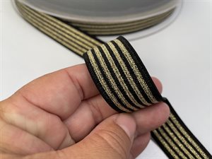 Blød elastik - sort med guld stribe, 2,5 cm